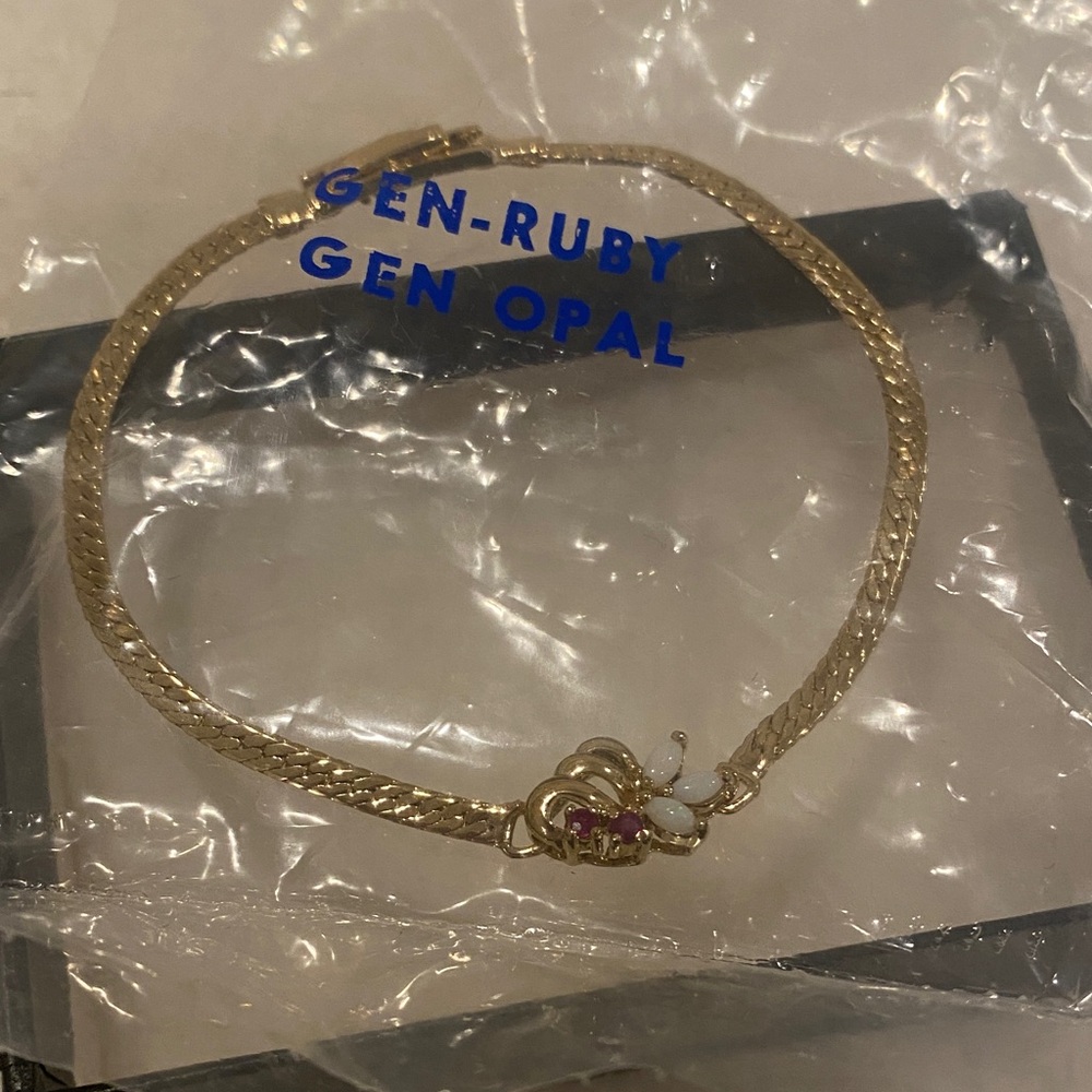 Elegant Gold Bracelet with Ruby and Opal Accents